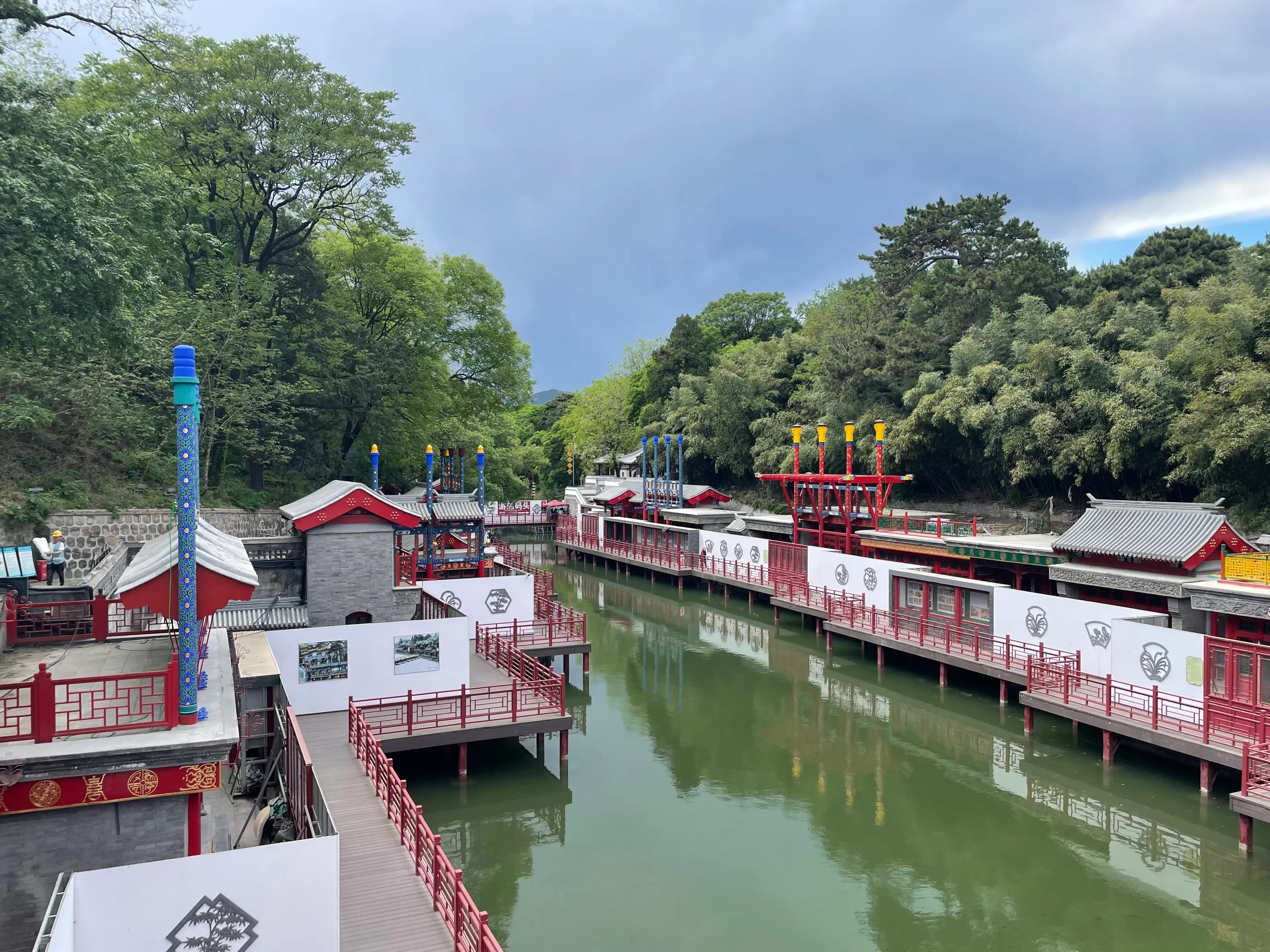 Canal-style shopping street and traditional architecture along Suzhou Street in the Summer Palace surrounded by trees and water in Beijing China
