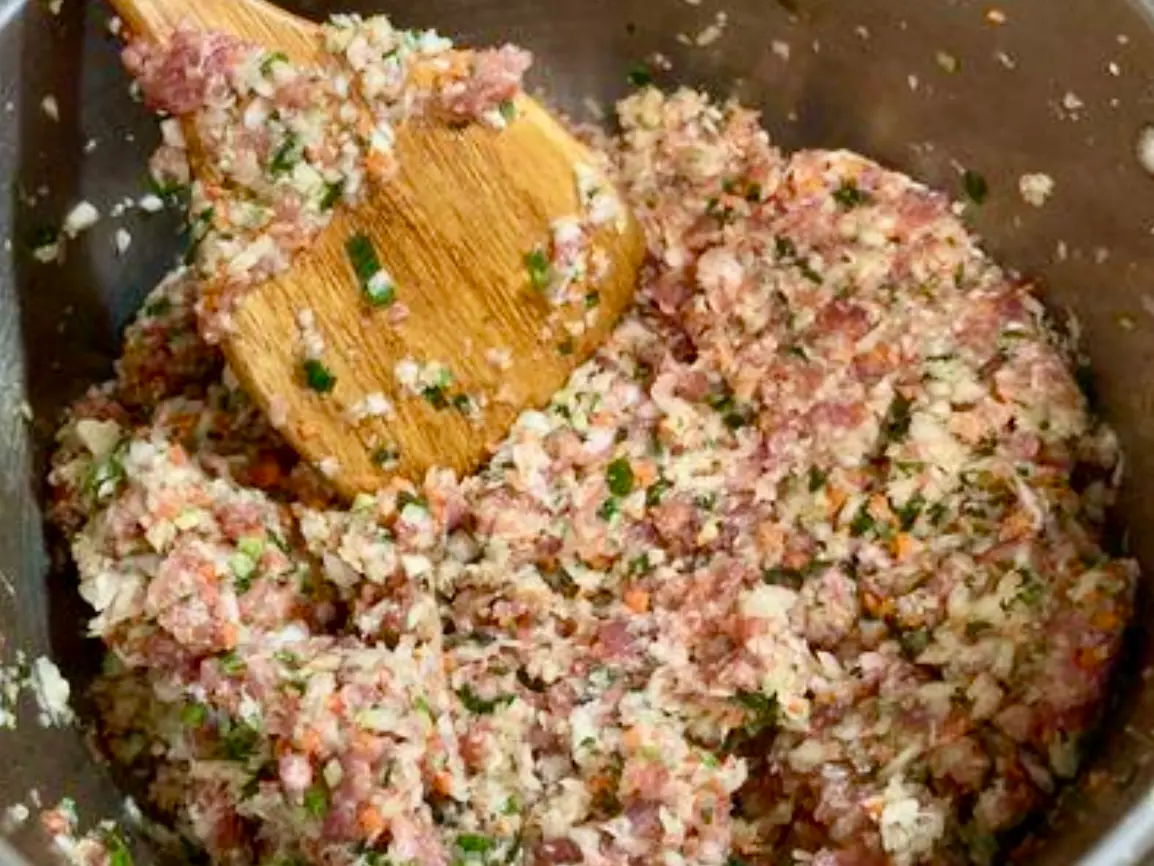 A bowl of mixed pork and napa cabbage dumpling filling