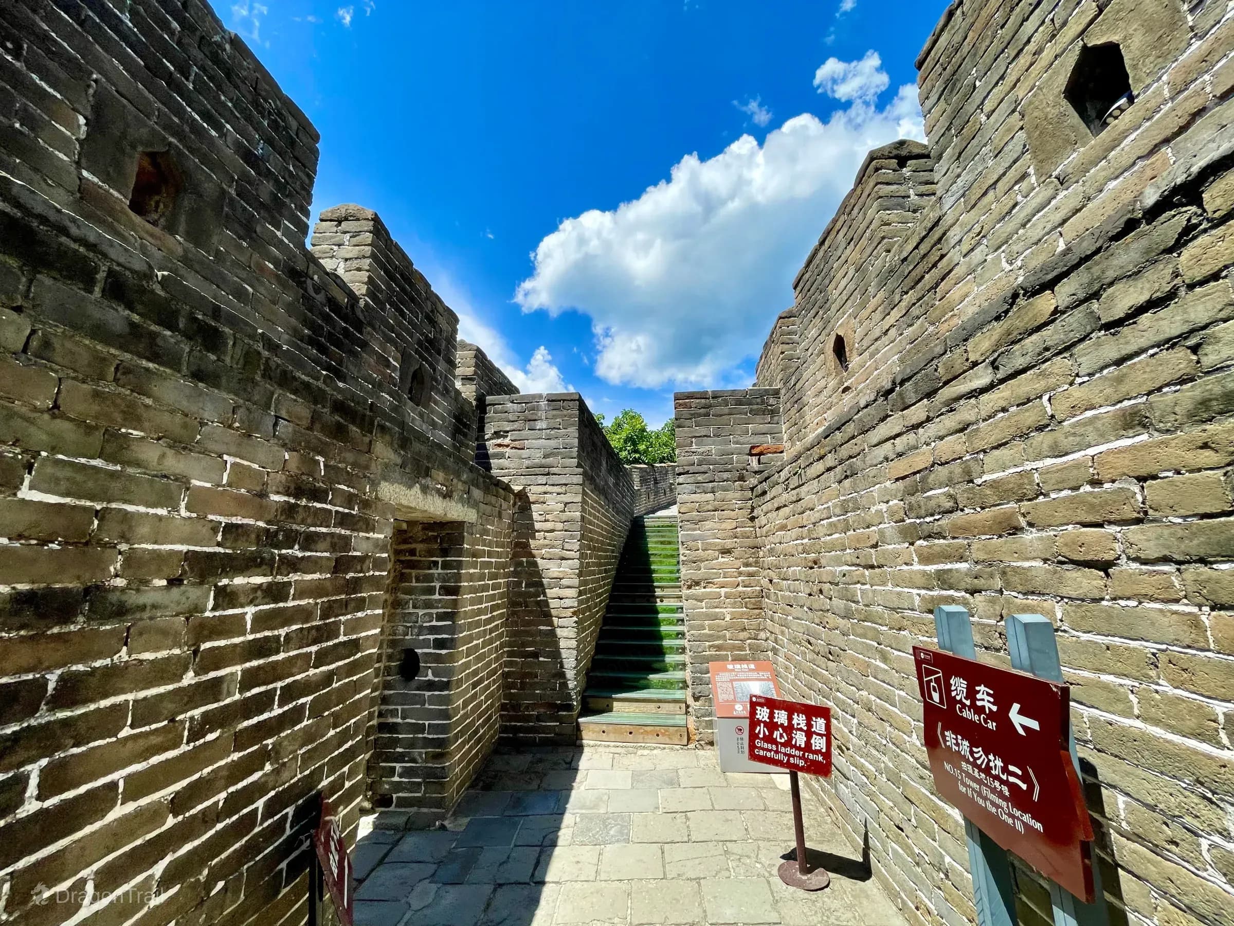 Glass ladder passage and directional signs near Mutianyu Tower 10