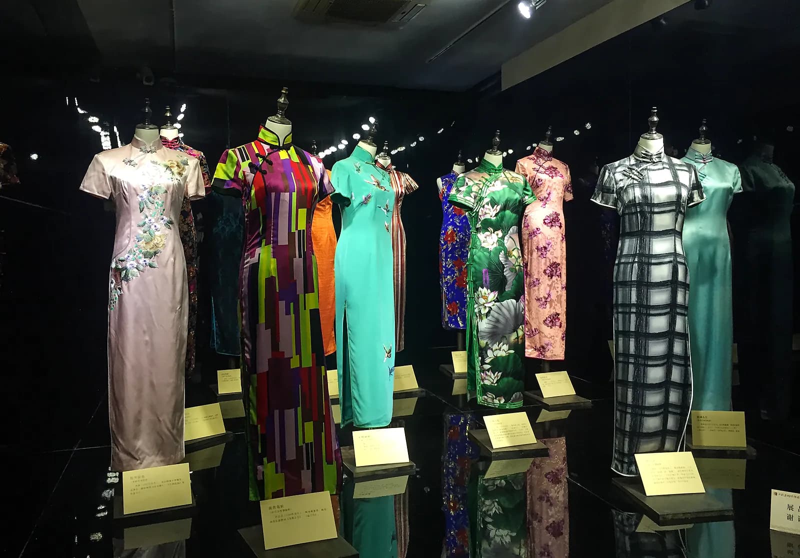 Several cheongsam dresses displayed at the Suzhou Pingtan Museum