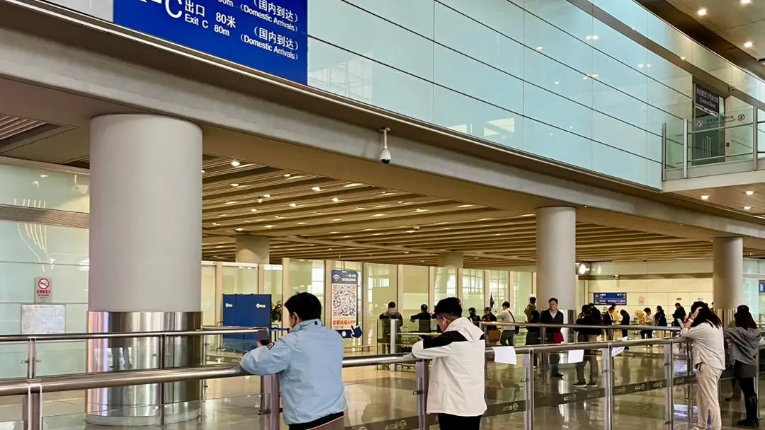 Beijing Capital International Airport Exit Area (PEK) Beijing Capital International Airport international arrivals exit area, signage and passenger waiting zone