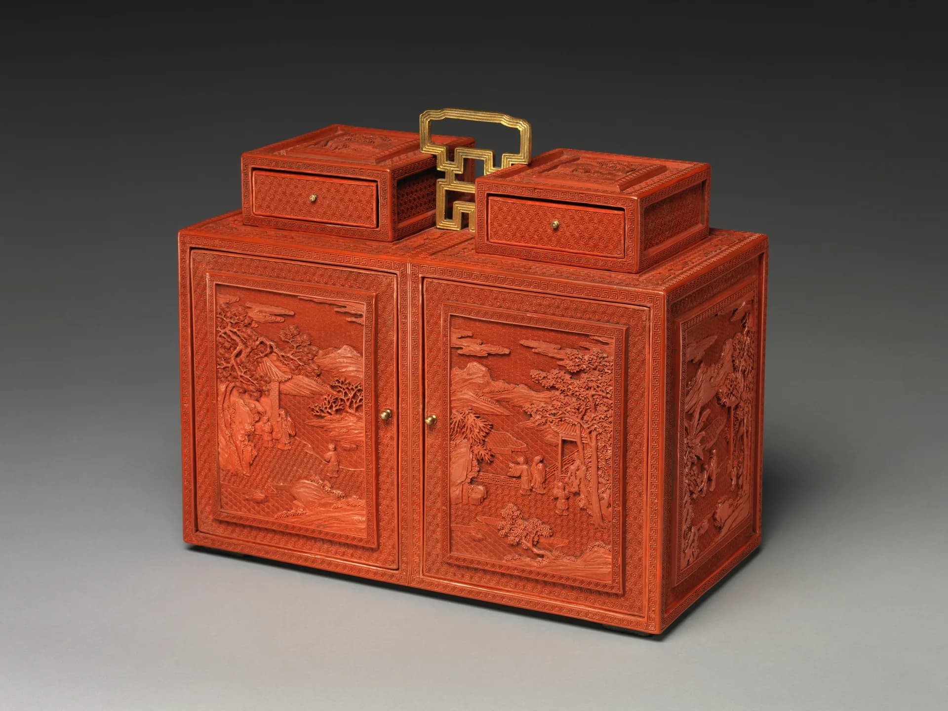 Qianlong-period Qing dynasty carved red lacquer cabinet with landscape figures