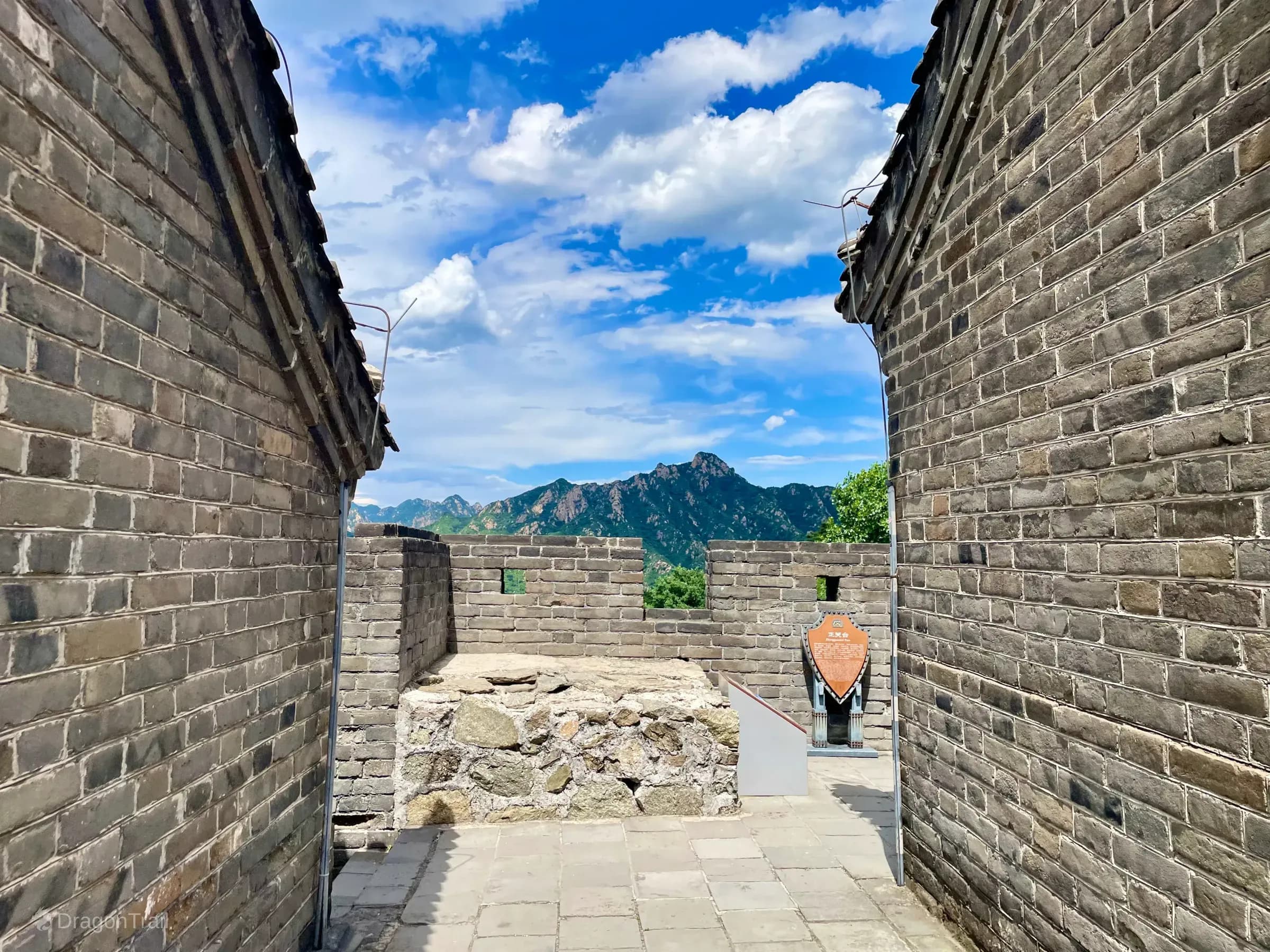 Mutianyu platform passage at Zhengguantai with mountain views beyond the battlements.