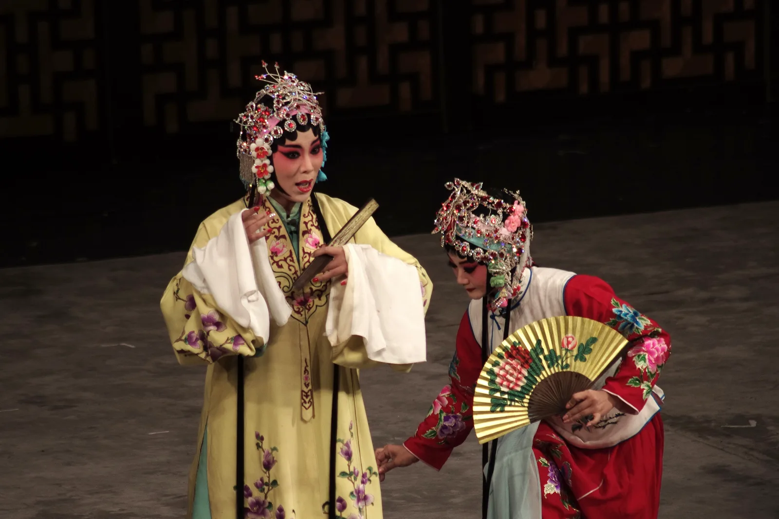Peking Opera performer in traditional costume and facial makeup.