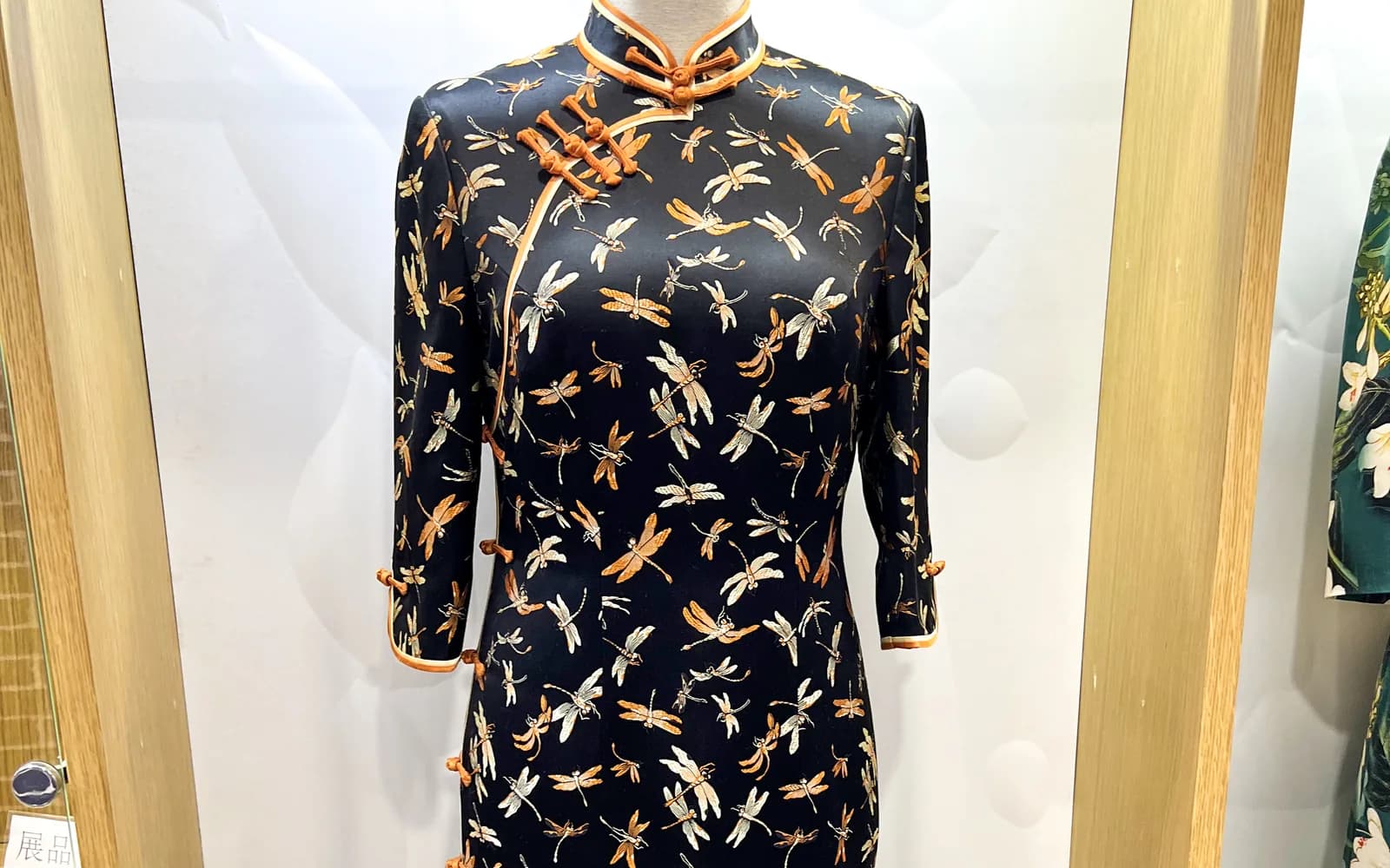 Black and orange qipao displayed in Beijing