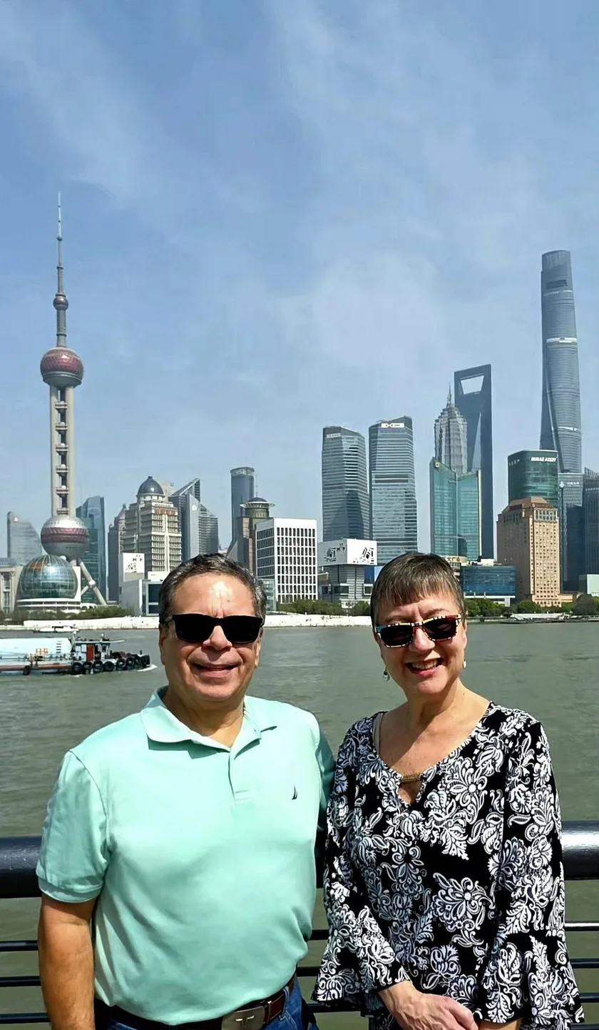 Family on a private Shanghai layover tour near the Bund and Pudong skyline.