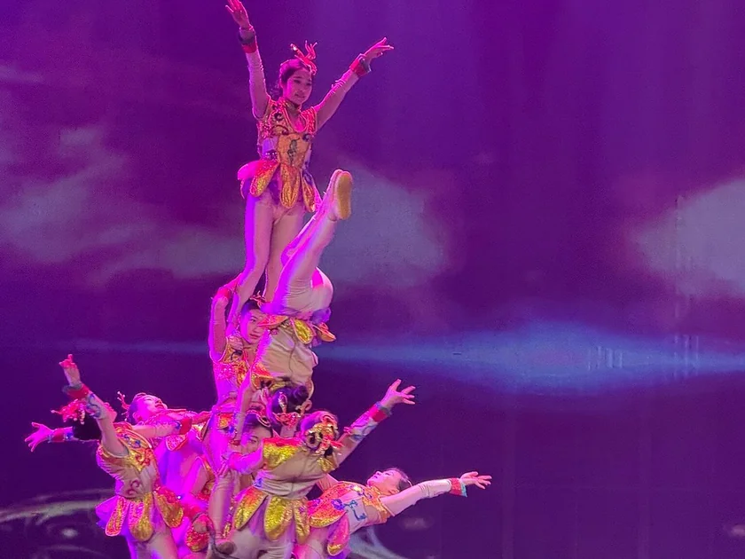 Red Theatre acrobatics stage with performers during an evening Beijing show.