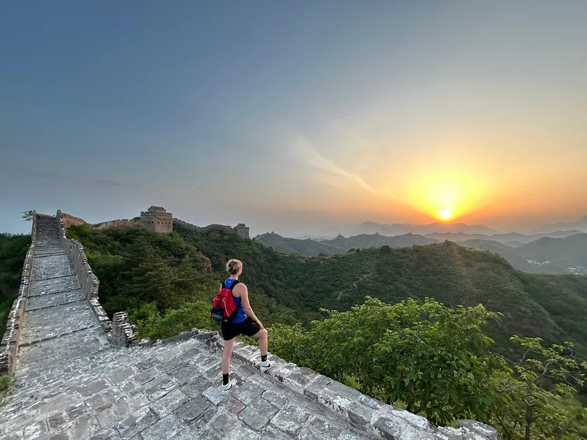 Couple on the Mutianyu Great Wall at sunset during a Beijing layover tour.