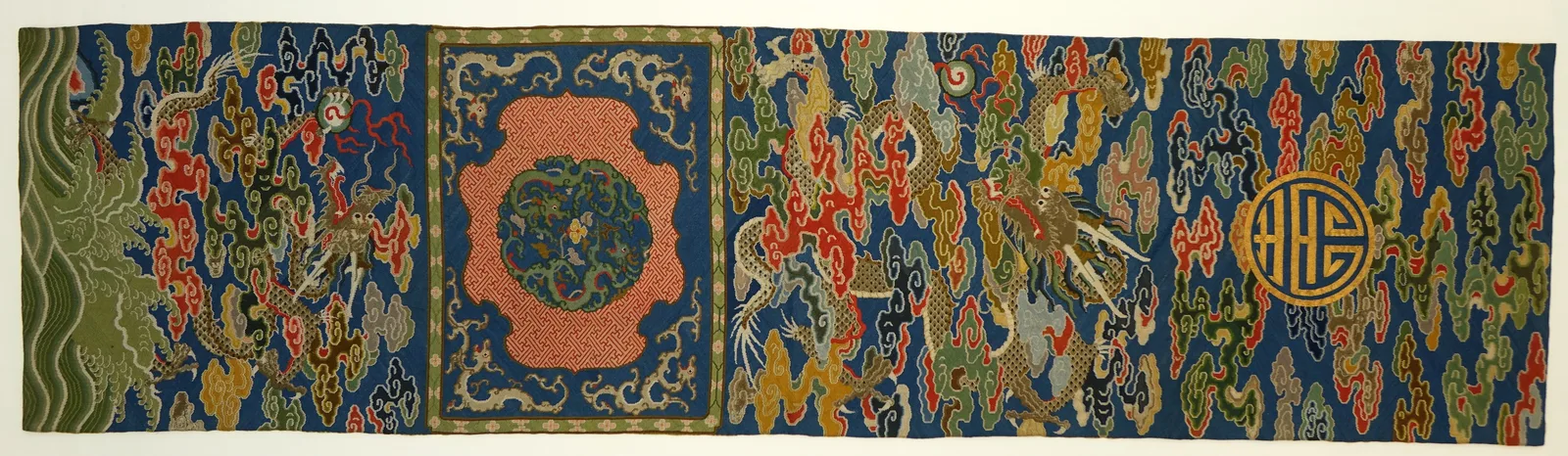 Qing chair strip with dragons — counted embroidery on silk gauze (Met)