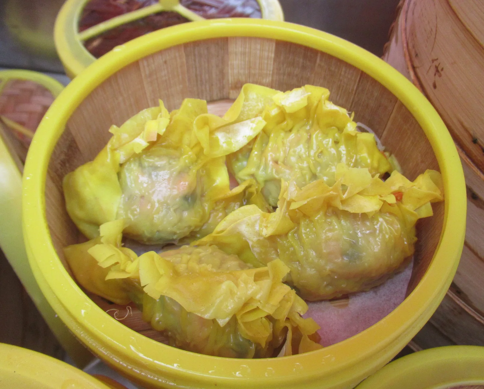 Chinese New Year festival foods including dumplings, fish and red decorations on a table