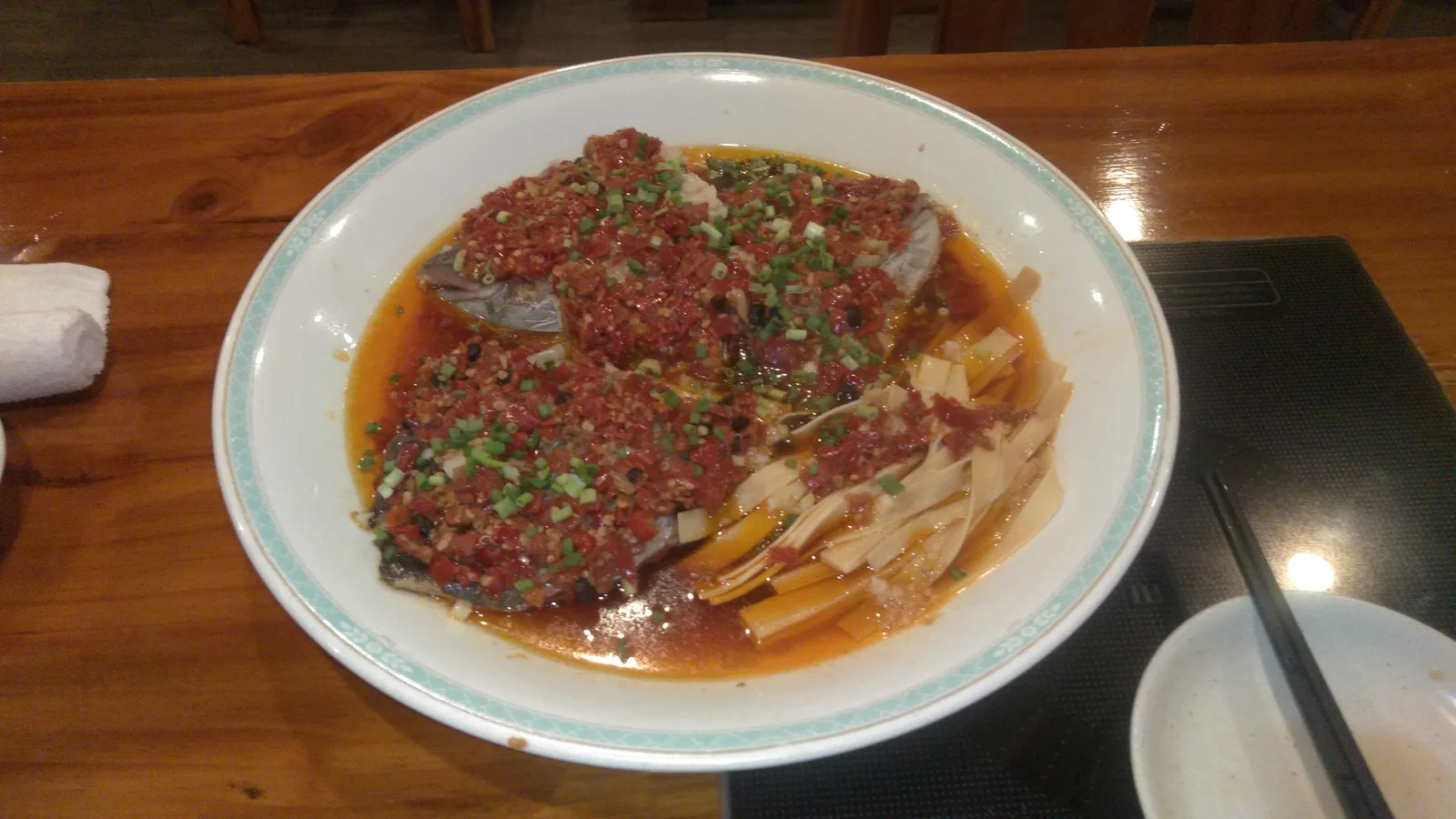 Steamed fish head topped with chopped chillies, a Hunan signature presentation