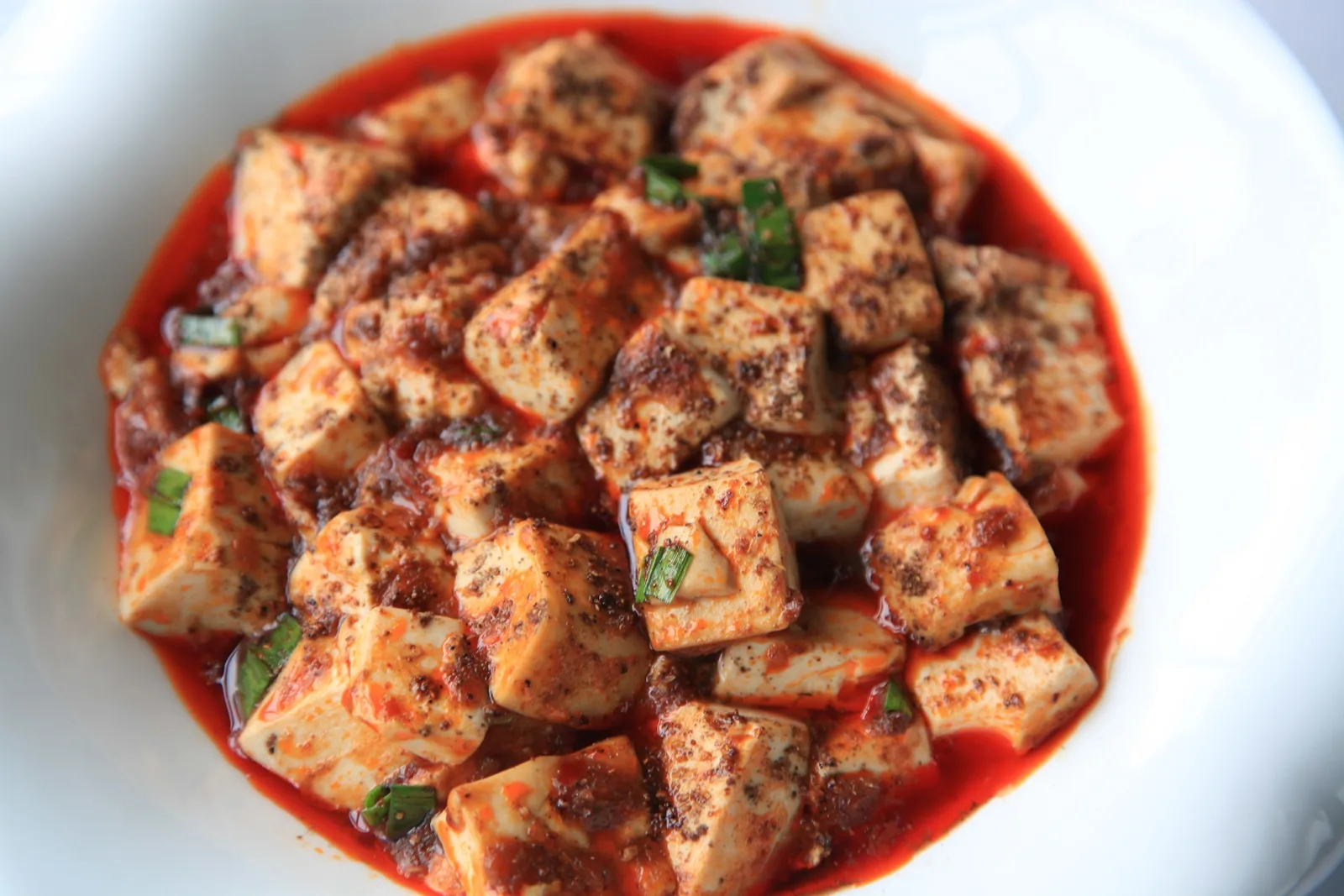 Mapo tofu in a Sichuan-style sauce with chilli and Sichuan pepper
