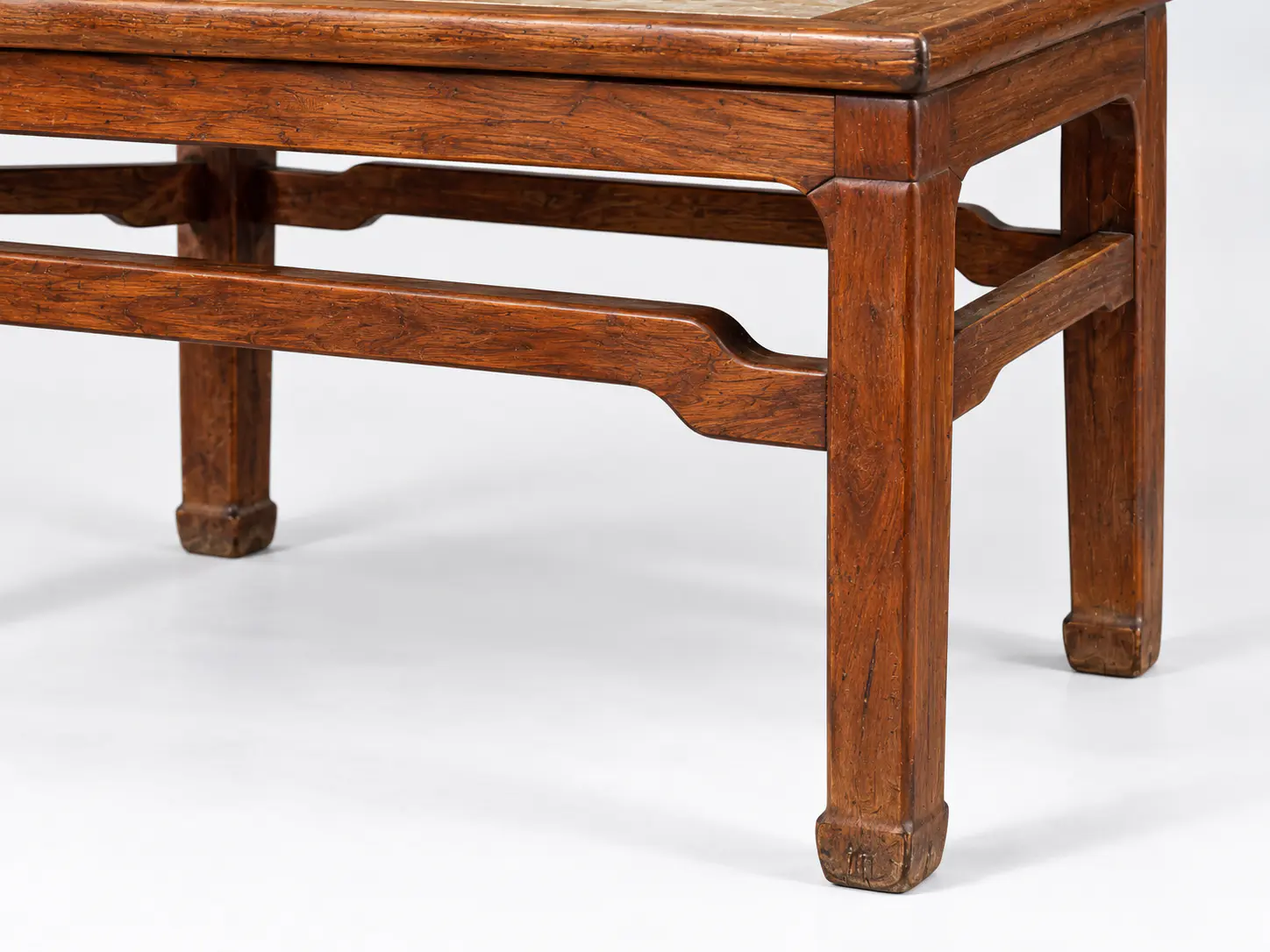 Detail of stretchers and leg relationships on a Ming huanghuali side table