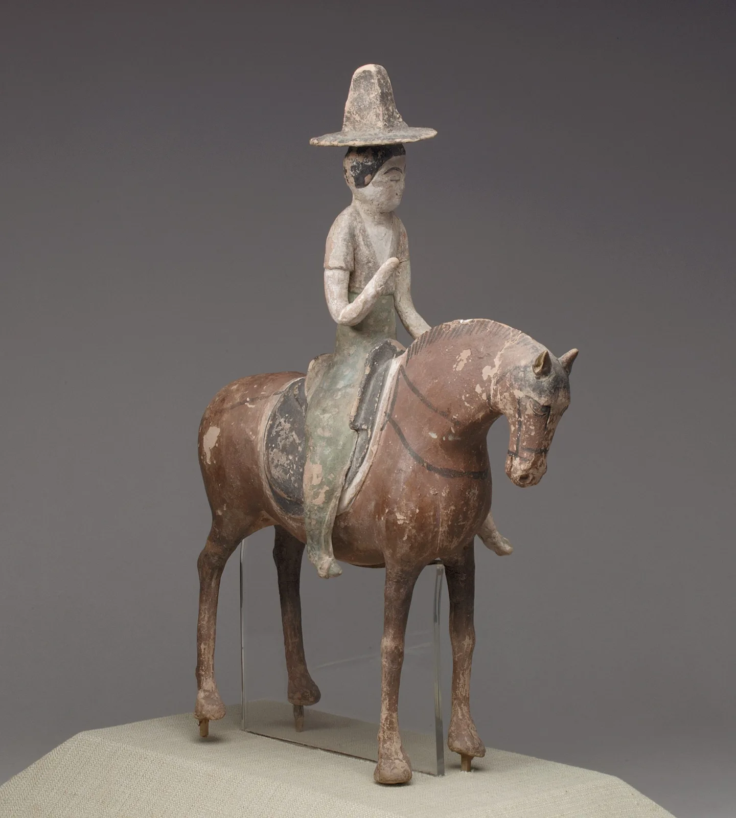 Tang dynasty painted pottery horse with a female rider figure