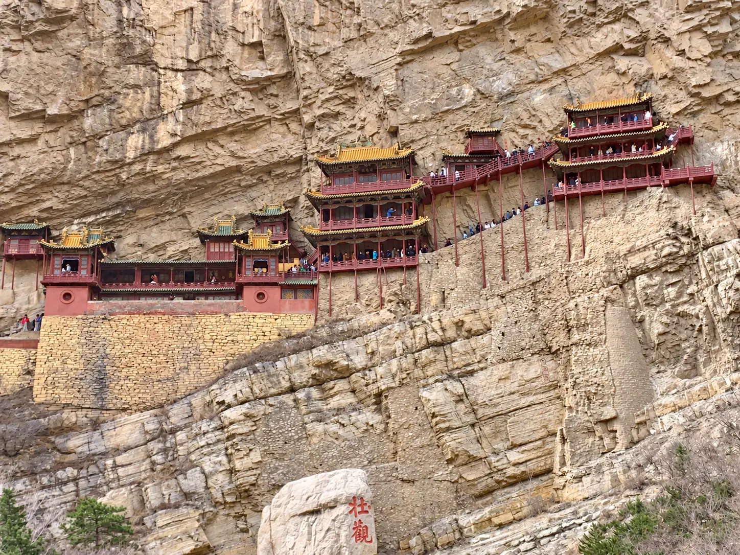Wooden halls and walkways of the Hanging Temple against the cliff near Datong.