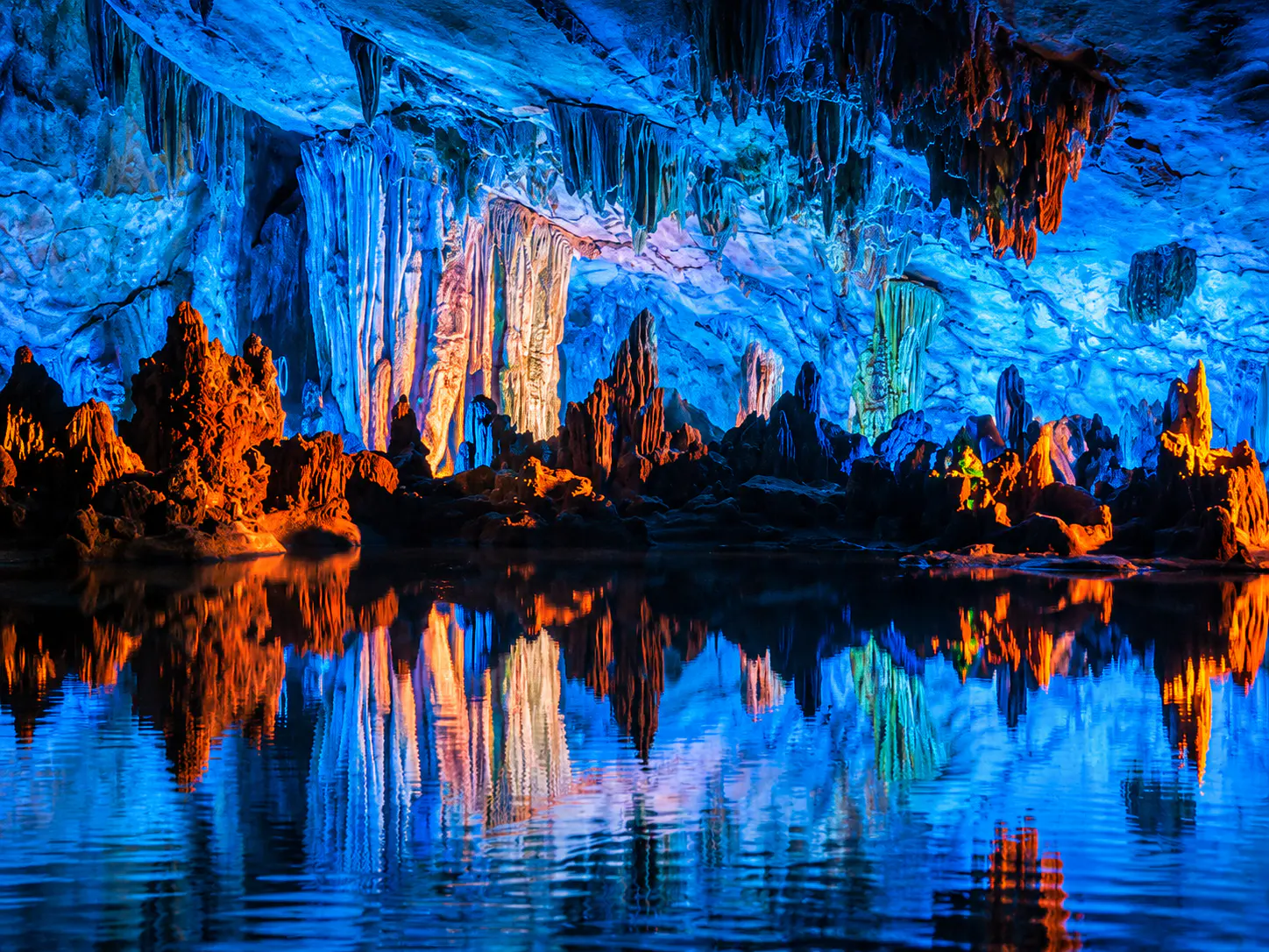 Illuminated limestone formations inside Reed Flute Cave in Guilin.