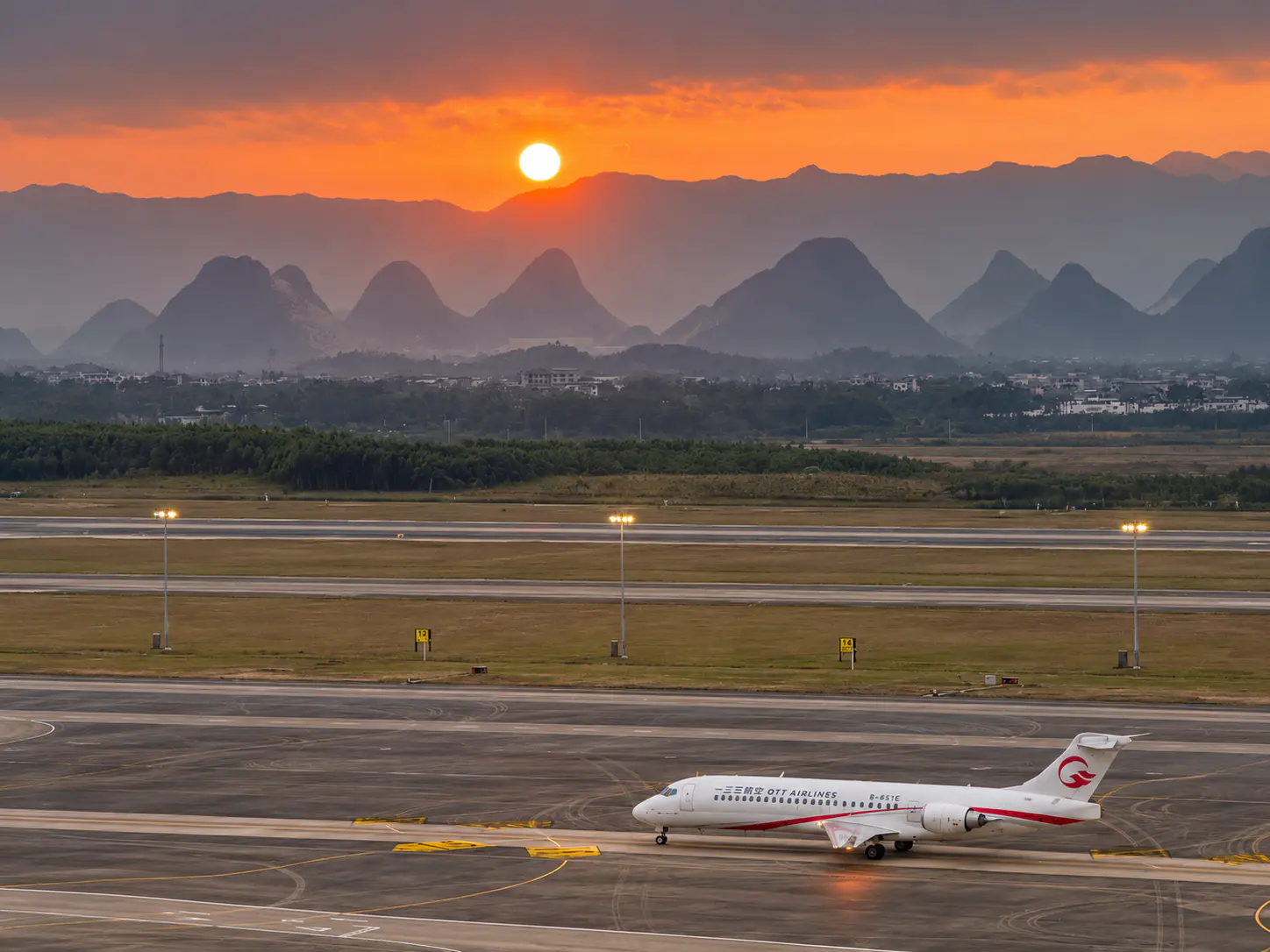 Runway and karst mountains at Guilin Liangjiang International Airport.