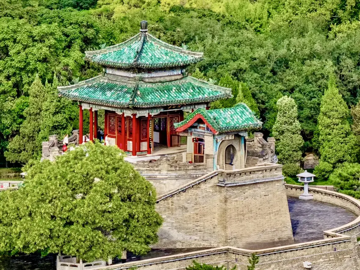 Green-tiled pavilion on the brick terrace of Wuling Congtai in Handan.