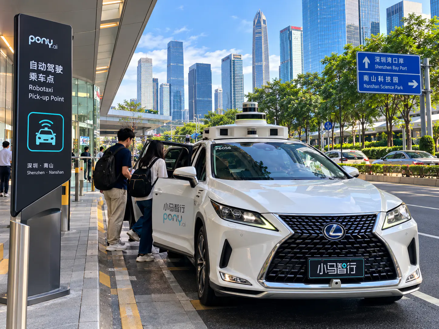 A driverless robotaxi picking up passengers on a Shenzhen street as part of a public autonomous-driving pilot